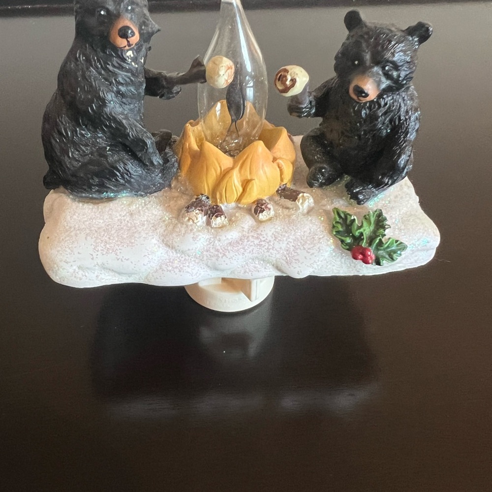 Plug in bear night light. Two bears sitting around a flickering camp fire.
